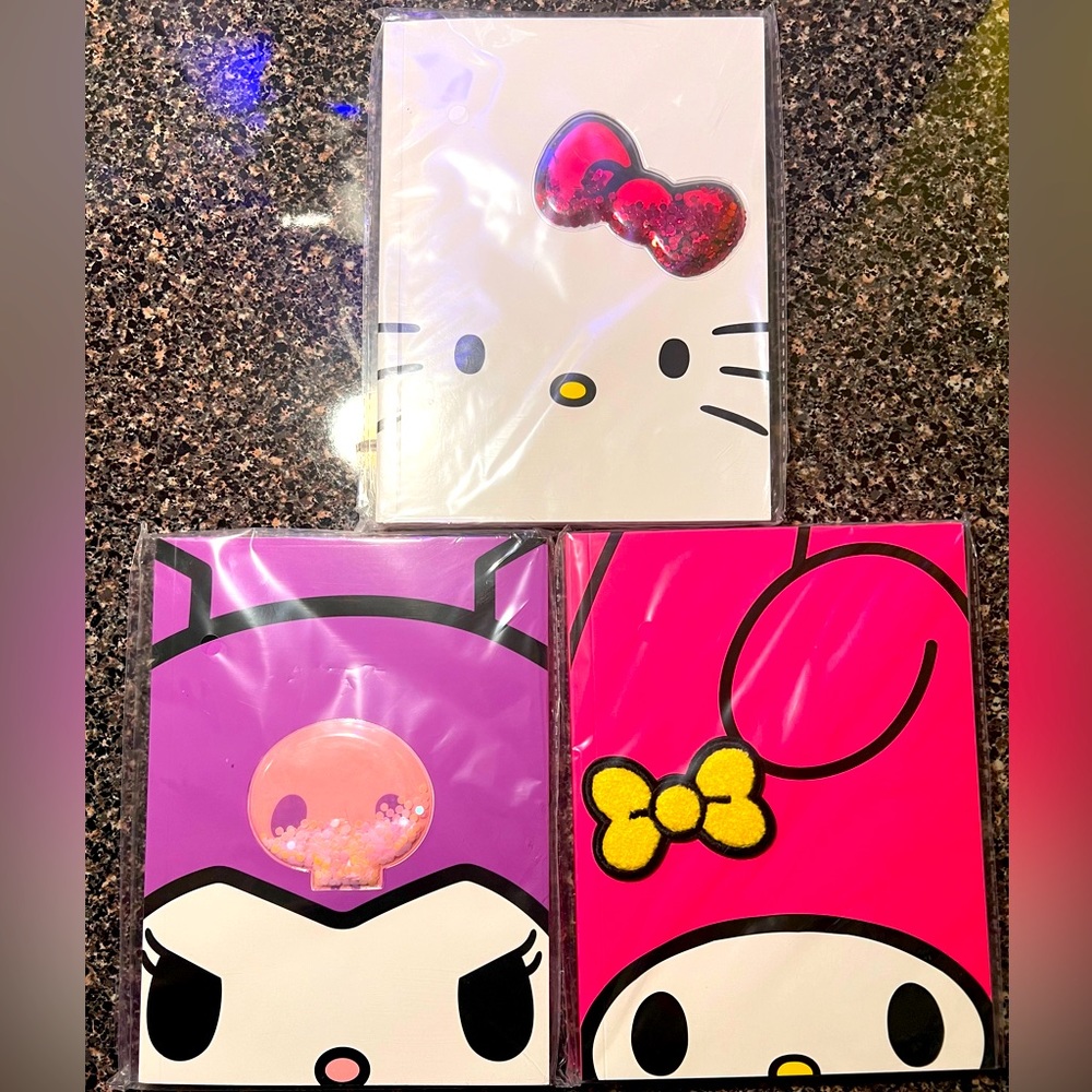 Three Hello Kitty Notebooks